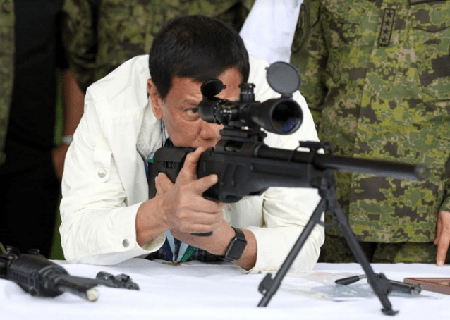 Duterte with gun